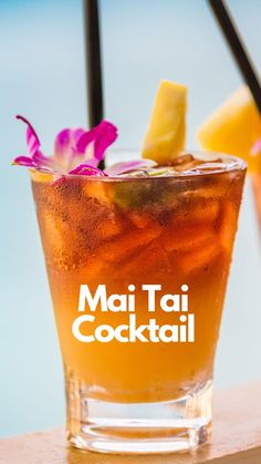 a tall glass filled with drinks next to a beach and the words mai tai cocktail