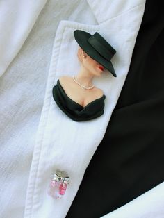 Elegant woman in black titfer hat. The brooch made of polymer clay. There are 3 ruby stones in a perfume bottle. This is my second C*co style brooch. Always stay beautiful and charming in your favorite clothes! Chic Brooch Jewelry For Parties, Chic Party Brooch Jewelry, Classic Black Brooches For Wedding, Classic Black Wedding Brooch, Classic Black Wedding Brooches, Classic Evening Brooch, Elegant Lapel Pin Brooch For Party, Elegant Collectible Lapel Pin, Vintage Black Lapel Pin As Gift