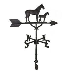 a weathervane with a cat on it's back and an arrow pointing to the right