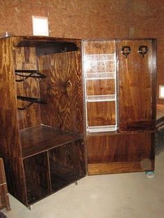 an empty room with wooden cabinets and shelves in the corner, including a shelf for shoes