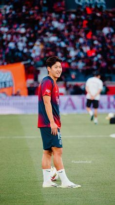 a man standing on top of a soccer field