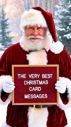 a man dressed as santa claus holding a sign that says the very best christmas card messages