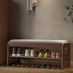 a wooden shoe rack filled with pairs of shoes