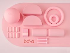 a pink tray with various items on it