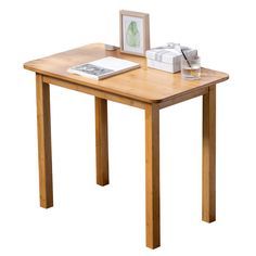 a small wooden table with a printer on top and a book sitting on the side