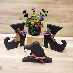 three witches are sitting on top of a table