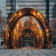 a person standing in the middle of a large tunnel with lights on it's sides