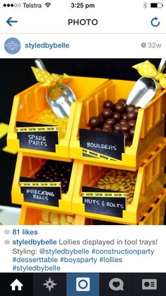 a stack of yellow containers filled with chocolate candies