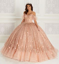 Tulle and glitter tulle ball gown with a sweetheart neckline, beaded bodice, basques waist, corset back, three-dimensional flowers throughout, stone and crystal accents and a detachable off-the shoulder beaded strap detail. Short Cape included. Available without Ruffled Hem as Style PR22144 Pink And Gold Quinceanera Dress, Rose Gold Quince Dress, Pink And Gold Quinceanera, Gold Quinceanera Dress, Gold Quince Dress, Gold Quinceanera Dresses, Rose Gold Quinceanera Dresses, Rose Gold Quinceanera, Quinceanera Dresses Gold