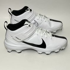 a pair of white and black nike shoes