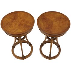 two wooden stools sitting next to each other on top of a white background,