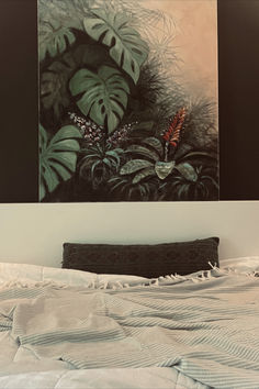 a painting on the wall above a bed