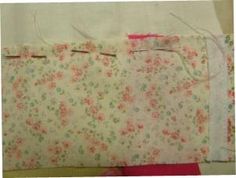 two pieces of fabric with flowers on them, one is white and the other is pink