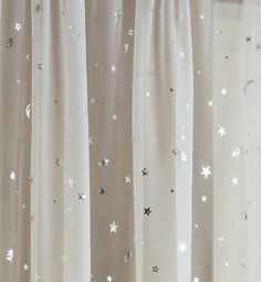 curtains with stars and moon designs on them