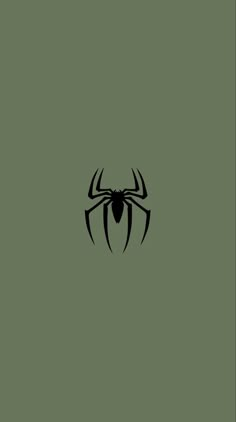 a black spider logo on a green background