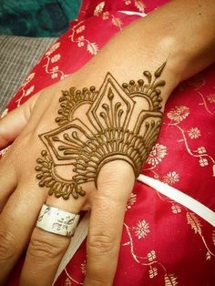 a woman's hand with henna on it