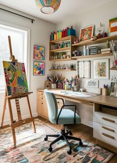 a room with a desk, chair and shelves filled with art supplies