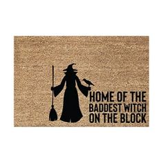 a door mat with the words home of the baddest witch on the block