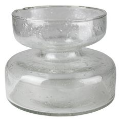 a clear glass candle holder on a white background