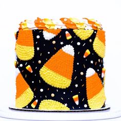 a cake decorated with candy corn and stars