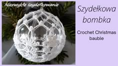 a crochet christmas bauble is shown with the words, stylekwoa bombka