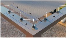 an image of a table that is being constructed with metal poles and balls on it