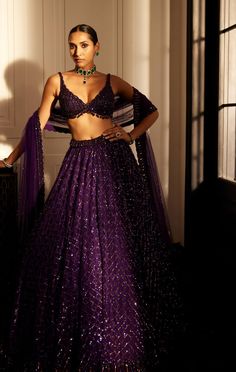 Embrace luxury with the royalty purple crystal embroidered lehenga set featuring an intricately hand-embroidered lehenga and dupatta adorned with sequins and crystal embroidery perfectly paired with a jewelled blouse embellished with crystals. Sequin Blouse Designs, Indian Reception Outfit, Modern Lehenga, Kerala Engagement Dress, Purple Lehenga, Vani Vats, Crystal Work, Sangeet Outfit, Purple Wedding Dress