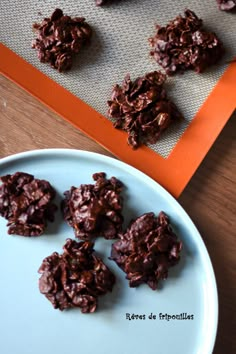 chocolate cookies on a plate next to an orange tray