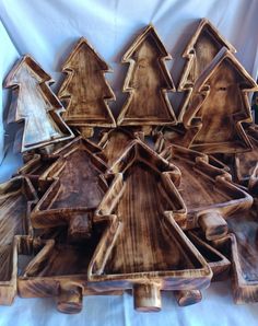 a group of wooden christmas trees sitting on top of each other