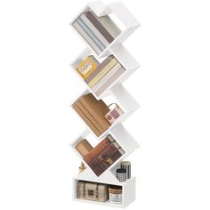 a white shelf filled with books and magazines