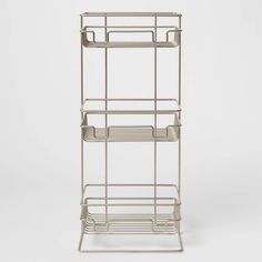 three tiered metal rack with two baskets on each side and one shelf below it