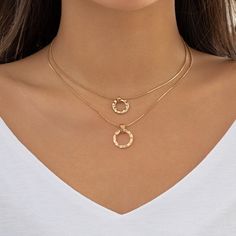 Description:Dainty Layered Metallic Halo Pendant Chain Necklace SetSpecification:Size: 13.8" - 15.7" Weight: 0.36 oz/setMaterial: copperColors: gold/silverFeatures and Details:This layered halo pendant choker necklace set is made of nickel-free. lead-free. cadmium-free and hypoallergenic materials. which will not turn your skin green or cause anaphylactic reaction.This gift for her chain necklace set is decorated with unique design and superb craftsmanship to create special piece that can satisf Gold-tone Plated Metal Chain Necklace, Minimalist Gold Alloy Charm Necklaces, Trendy Gold Alloy Charm Necklace, Gold Minimalist Alloy Charm Necklace, Minimalist Gold Alloy Charm Necklace, Gold Minimalist Charm Necklace, Metal Layered Necklace With Delicate Chain, Layered Metal Necklace With Delicate Chain, Layered Round Necklace With Delicate Chain