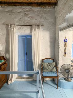 a room with blue floors and white walls