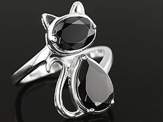 1.33ct oval and 2.03ctw pear shape black spinel rhodium over sterling silver cat ring. Measures approximately 13/16"L x 1/16"W. Not sizeable. Elegant Round Ring With Cat Design, Elegant Cat Design Ring Jewelry, Elegant Cat Design Jewelry Ring, Silver Cat Ring, Spinel Jewelry, Silver Jewelry Diy, Quirky Jewelry, Sterling Silver Cat, Cat Ring