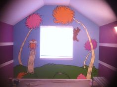 the dr seuss bedroom is painted with purple and orange colors, including two trees