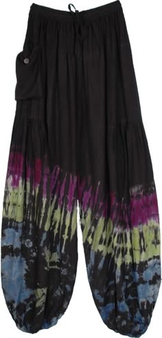 As dark as the night and as vibrant as your mood, these harem pants are a vision.  The dark black background sets the perfect base for the multicolor tie-dye pattern of purple, green, blue, and white. #tlb #SplitSkirtsPants #Yoga #vacationclothing #beachwrap #bohemianfashion #TieDye #Summerpants #HiippiePants #harempants #loungepants Hippie Style Black Wide Leg Pants, Black Wide Leg Hippie Pants, Black Hippie Bottoms With Elastic Waistband, Black Hippie Pants For Spring, Black Hippie Long Pants, Black Wide Leg Hippie Bottoms, Black Hippie Harem Bottoms, Bohemian Black Harem Pants With Elastic Waistband, Black Harem Pants With Elastic Waistband For Festivals