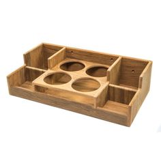 a wooden tray with four compartments on it