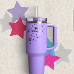 the tumbler cup is purple with stars around it