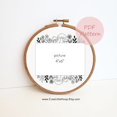 a cross stitch pattern with the words picture 4x4 in front of an embroidery hoop