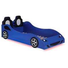 a blue car shaped bed with wheels and tires on the sides, in front of a white background