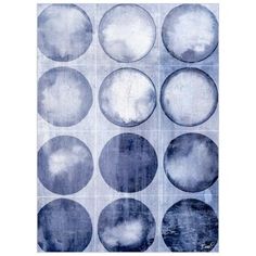 a blue and white painting with circles on it's side, all in different sizes