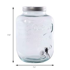 a large glass jar with a metal lid and an outlet for the faucet