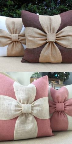 three different pillows with bows on them