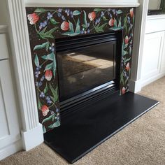 the fireplace is decorated with flowers and leaves