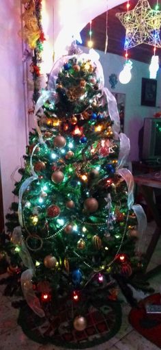 a decorated christmas tree in a living room