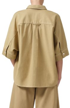 Roomy elbow-length sleeves frame a relaxed button-up shirt cut from rigid, midweight cotton twill. 26 1/2" length (size Medium) Front button closure Spread collar Elbow-length sleeves Chest patch pocket 100% regenerative cotton Machine wash, tumble dry Imported