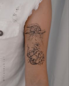 a woman with a tattoo on her arm