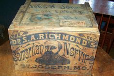 an old wooden box sitting on top of a table