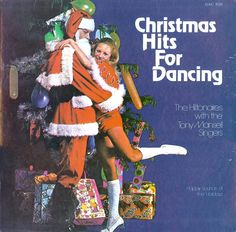 an advertisement for christmas hits for dancing with santa and mrs claus on the front cover