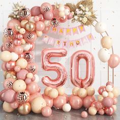 the number 50 is surrounded by balloons and streamers